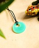 wisiory Turkusowy okrągły wisiorek świecący w ciemności i UV handmade 2,5 cm 4