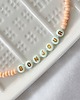 breloki Charms do telefonu  BONJOUR peach 1