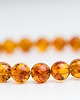 bransoletki z kamieni naturalnych Bransoletka bursztyn koniakowy kulka regularna 1