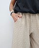 spodnie materiałowe damskie Tkaninowe spodnie boucle z falbankami - Beige 6